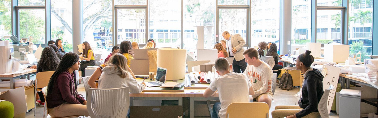 University of Miami School of Architecture students working together in a classroom